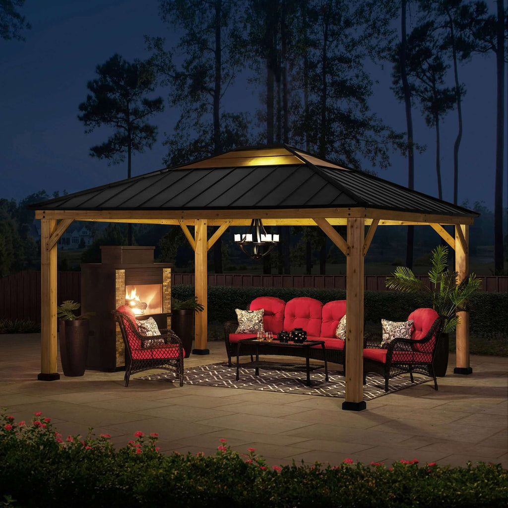 ERNIR 393cm x 452cm Cedar Wood Gazebo with Anthracite Steel Hardtop Roof - full view night